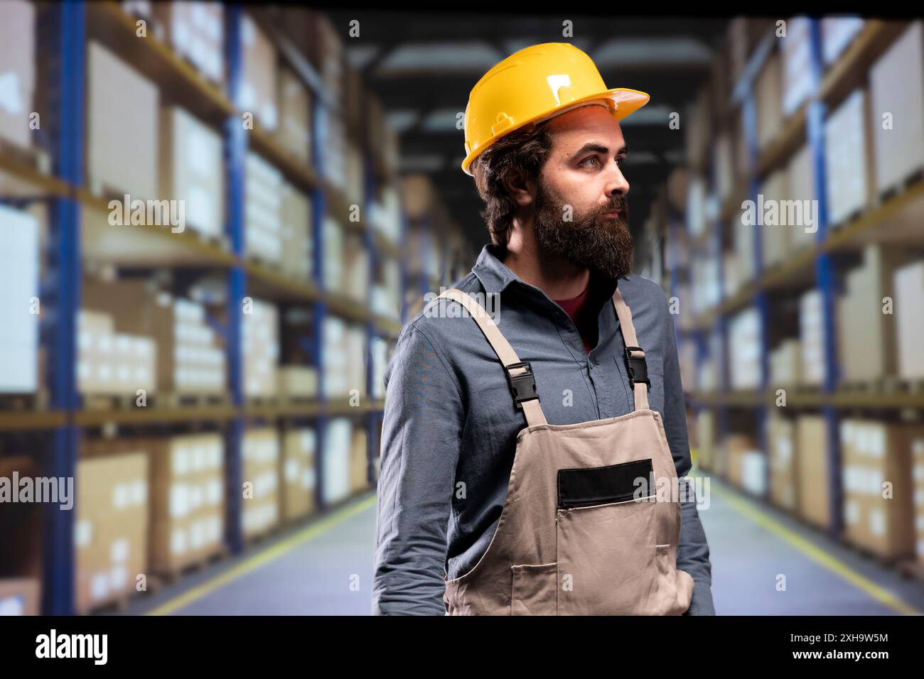 Packaging employee verifying merchandise stock on industrial racks ...