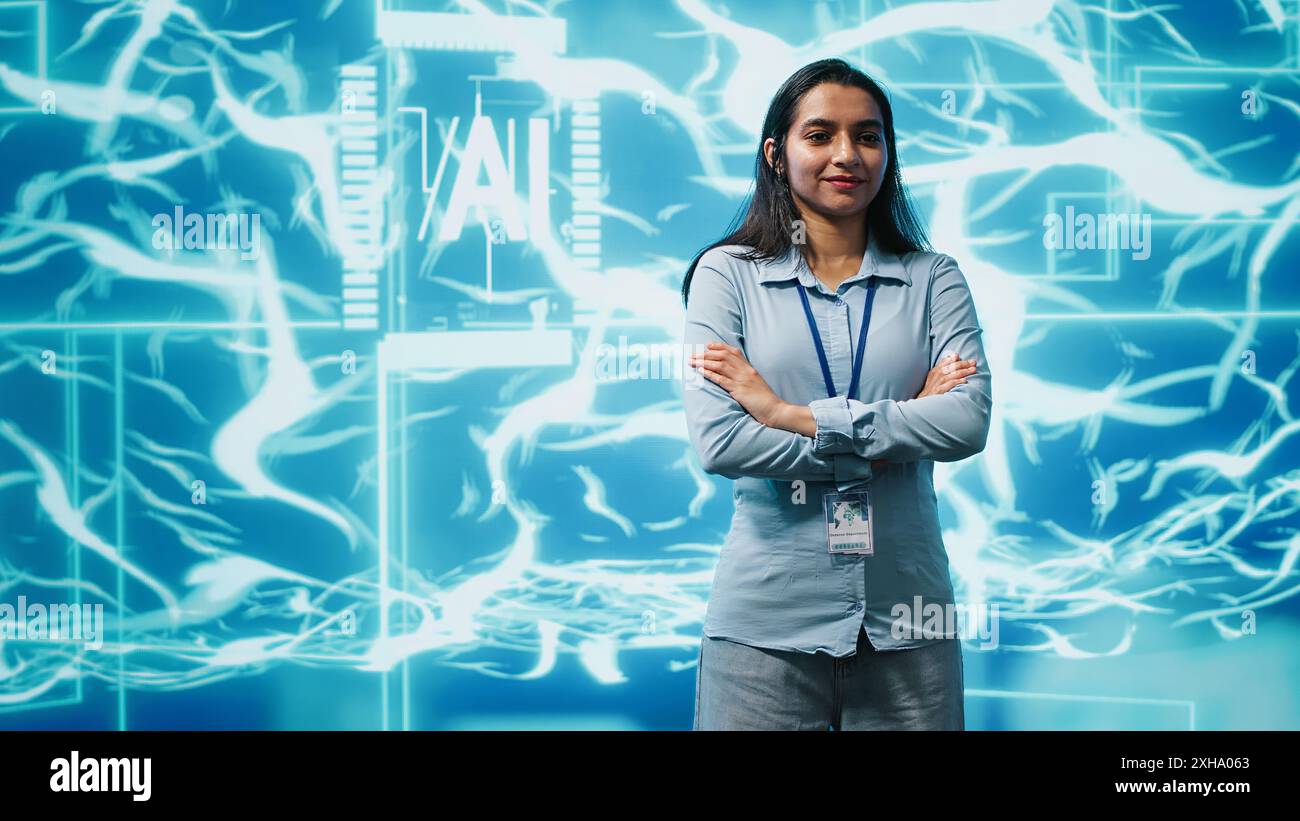 Portrait of smiling technician running artificial intelligence programming scripts. Joyful admin working in IT department tasked with AI applications development, camera A Stock Photo