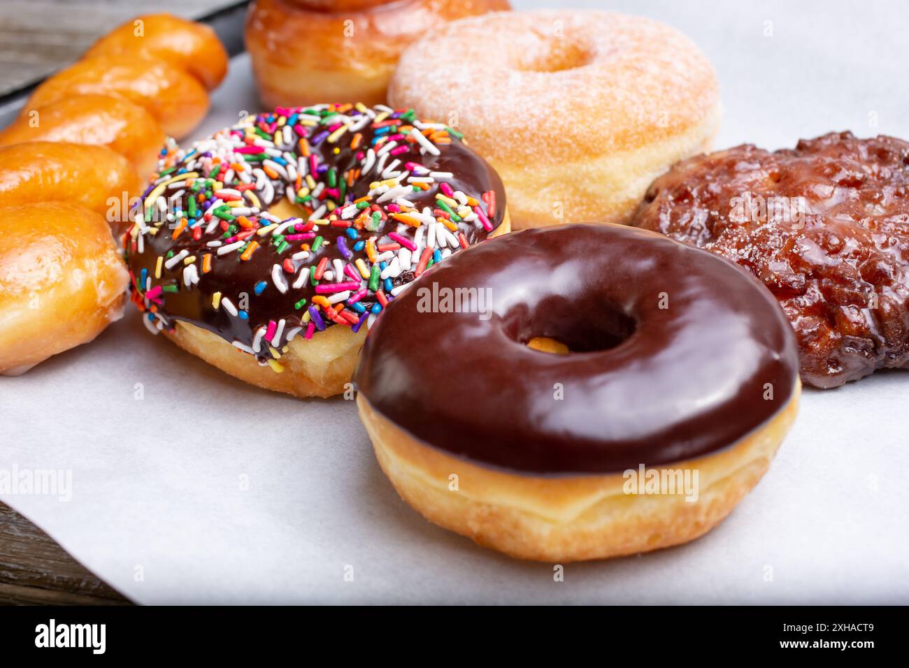 A view of a tray of a variety of popular donut flavors. Stock Photo