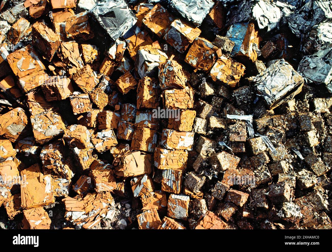 Pile of steel scrap metal industrial waste crushed recycled car bodies waiting to be melted down recycled at iron foundry Stock Photo