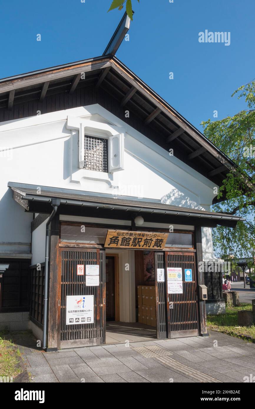 Experiencing the charm of Kakunodate Station on a bright, sunny spring day: The nearby Tourist Information Centre, which offers a luggage storage serv Stock Photo