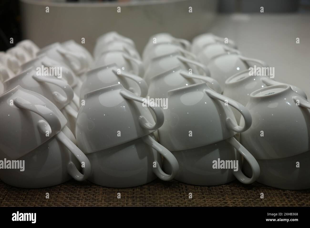 Ceramic cups for tea or coffee on a jute background Stock Photo