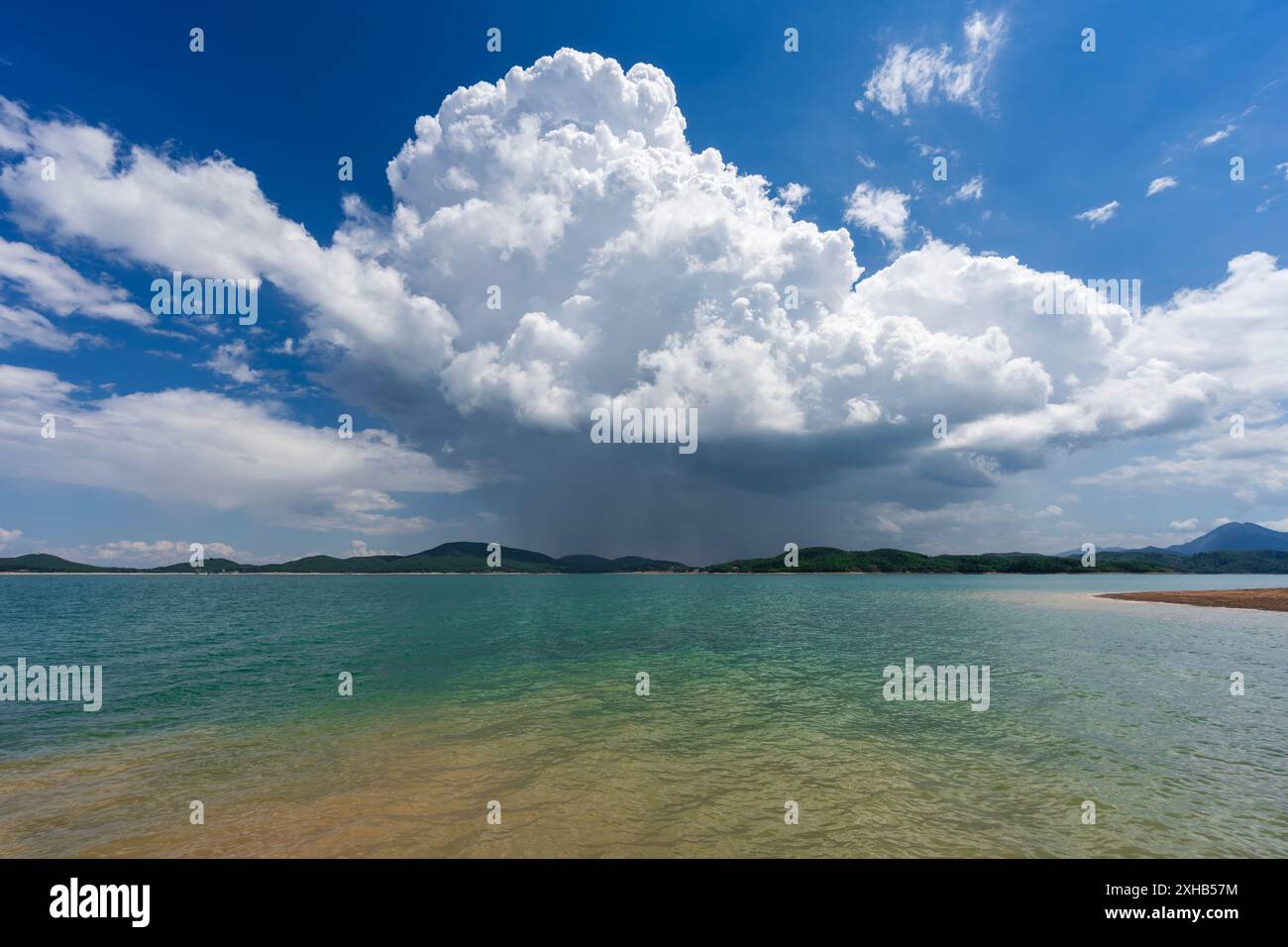 Praecipitatio Serene Lake Plastiras in Thessaly, Greece, under dramatic Cumulonimbus ...