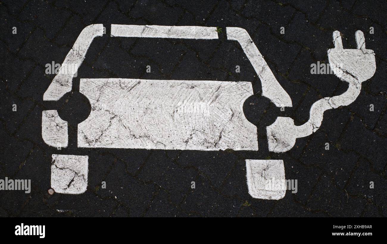 Icon on the asphalt for a parking lot with charging point for electric cars Stock Photo