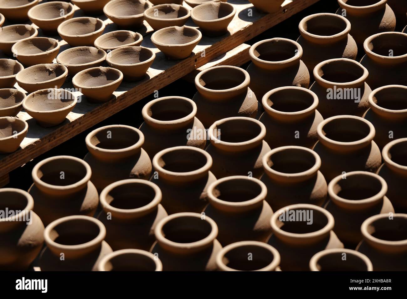 A potter crafts earthenware pottery on clay in Pune, India Stock Photo ...