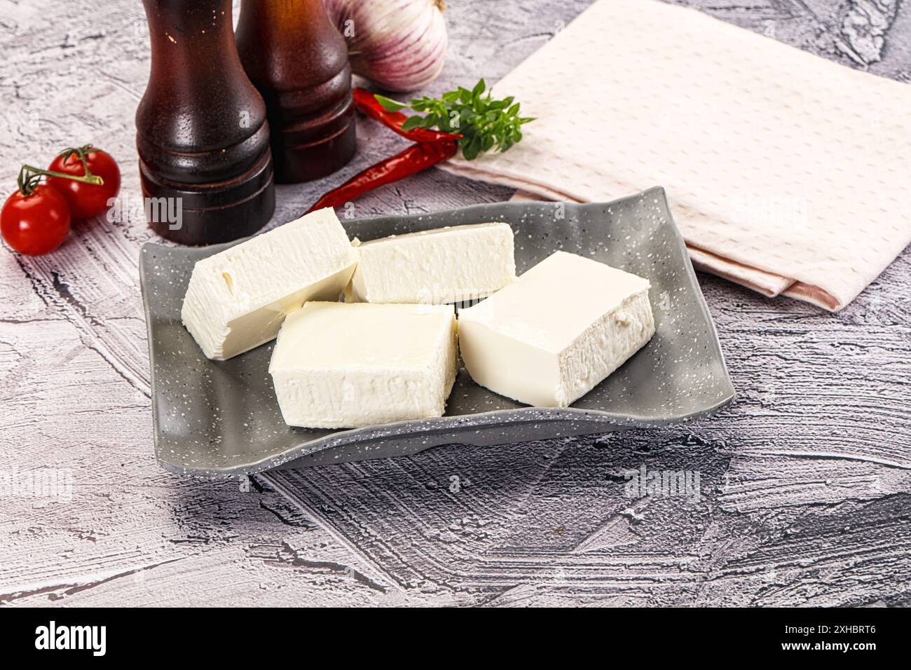 Greek traditional cuisine - Feta cheese bricks Stock Photo - Alamy