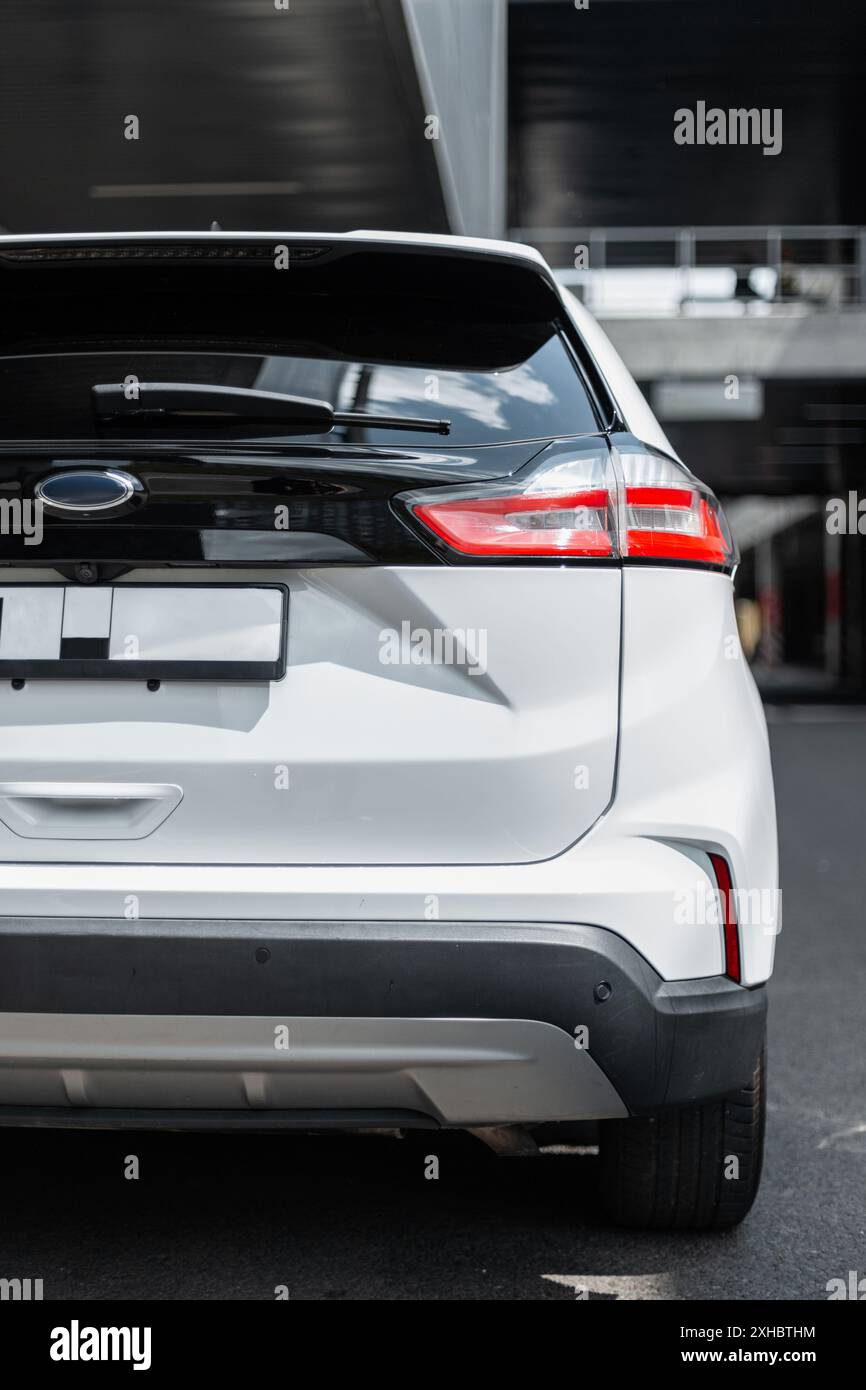 Beautiful modern SUV car in the city. Rear of the car Stock Photo - Alamy