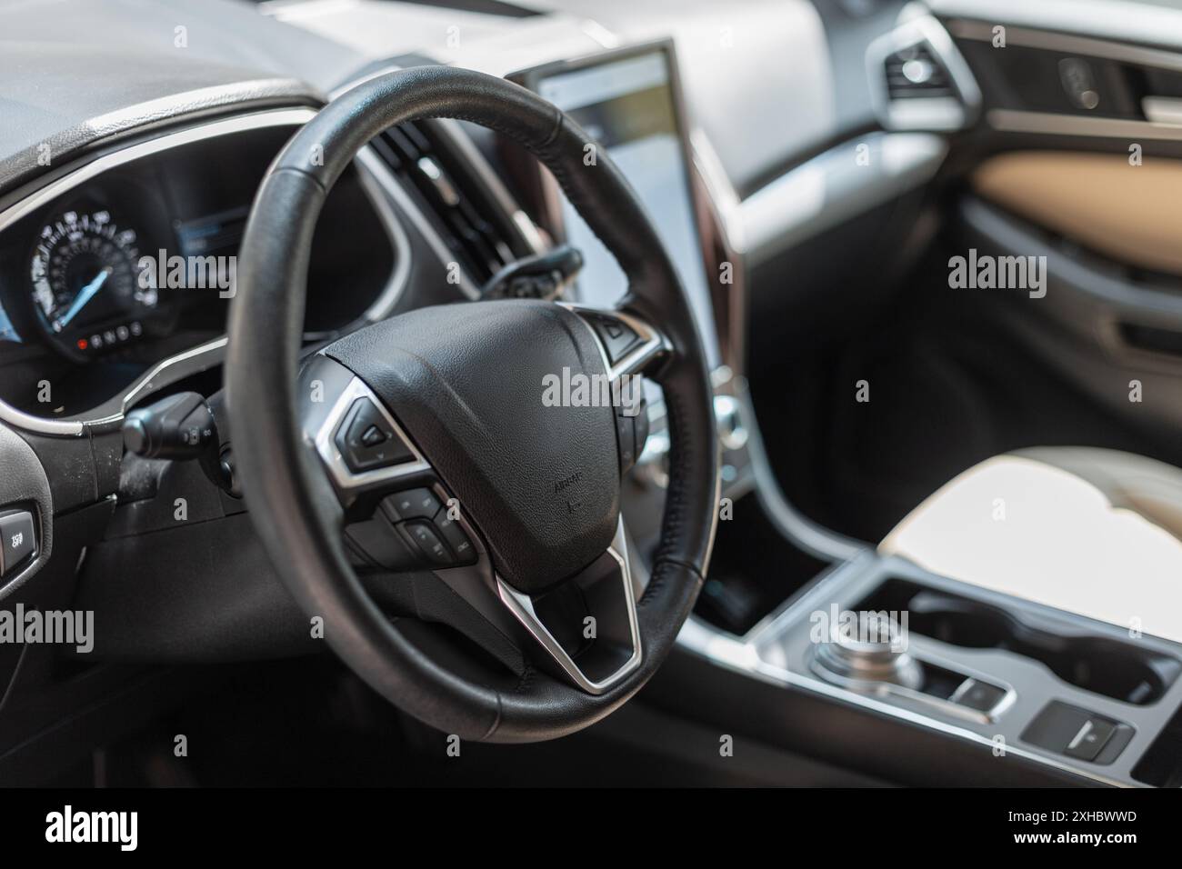Car interior with steering wheel and control panel Stock Photo