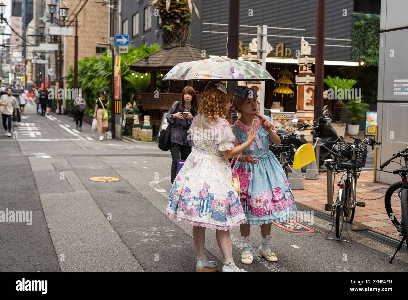 Shinsaibashi is a district in the Chūō-ku ward of Osaka, Japan and the city's main shopping area, two girls dressed up anime fashion cosplay Stock Photo