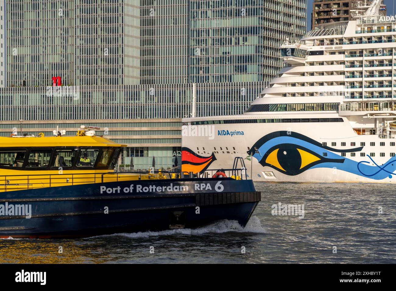 Rotterdam, skyline at the Nieuwe Maas, skyscrapers at the 'Kop van Zuid' district, cruise ship 'Aida Prima at the Cruise Terminal, Netherlands Stock Photo