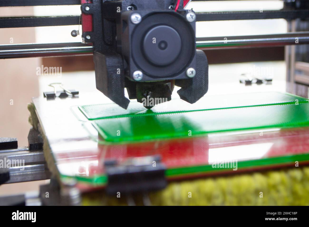 3D printer close up. A working 3D printer in process of printing object ...