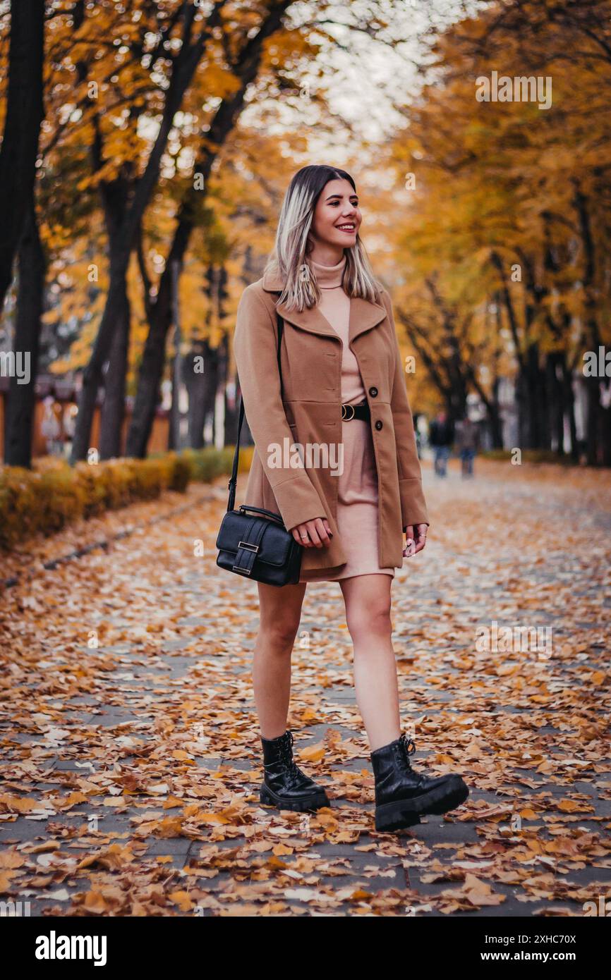 Woman black coat in hi-res stock photography and images - Alamy