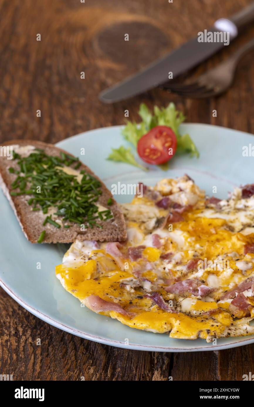 Scrambled eggs on a blue plate Stock Photo