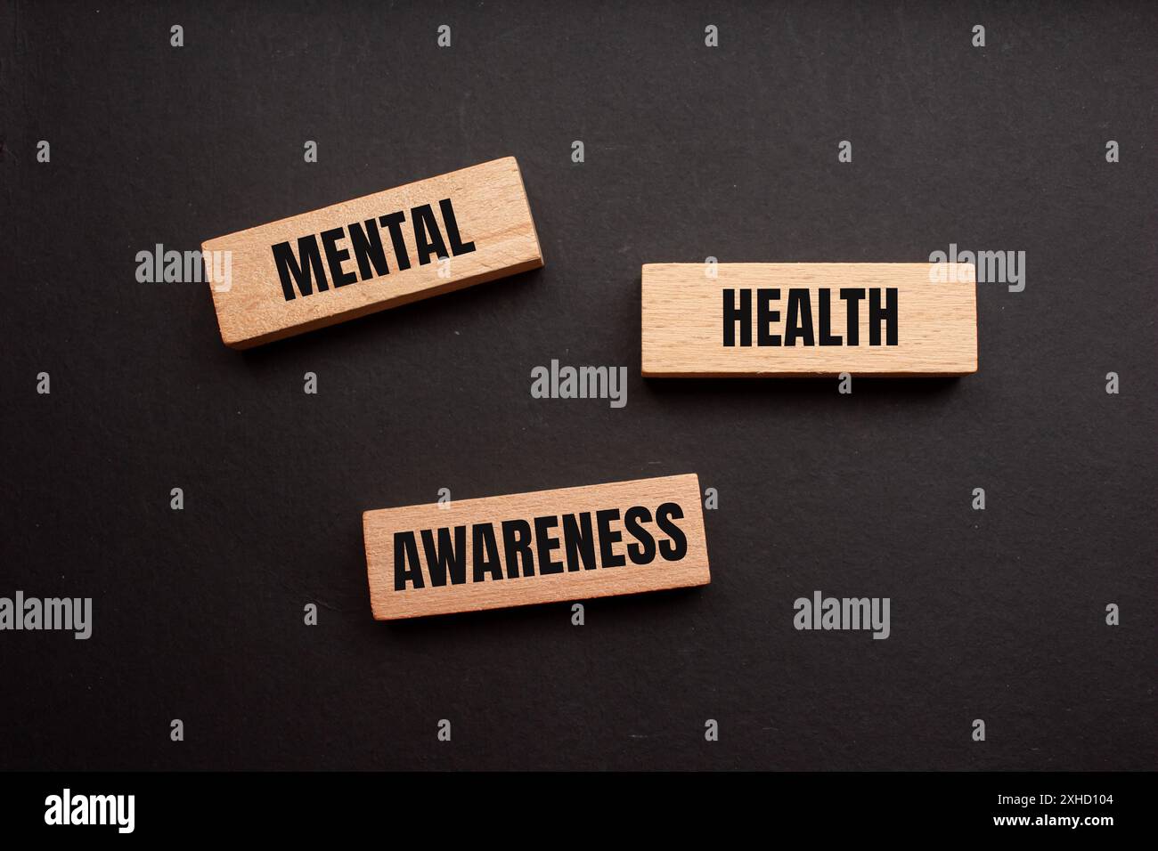 Mental health awareness message written on wooden blocks with black background. Conceptual mental health awareness symbol. Copy space. Stock Photo