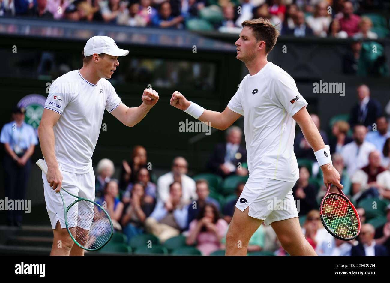Henry Patten (right) and Harri Heliovaara celebrate winning a point ...