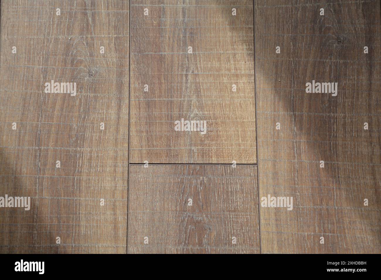 Closeup of laminate hardwood flooring showing the wood grain. Stock Photo