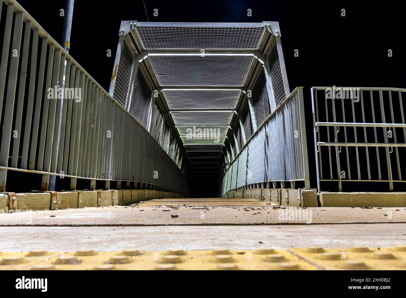 Night view of a pedestrian walkway that passes over a highway in Brazil Stock Photo