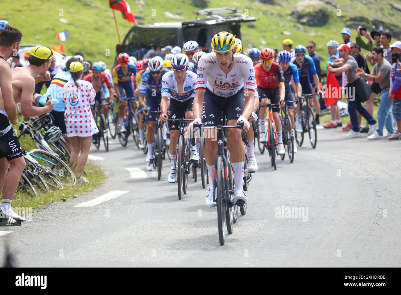 Bareges, France, 13th July 2024: UAE Team Emirates cyclist, Nils Politt (14) leading the main peloton during the 14th stage of the 2024 Tour de France between Pau and Saint-Lary-Soulan Pla d´Adet, on 13th July July 2024, in Bareges, France. Credit: Alberto Brevers / Alamy Live News. Stock Photo