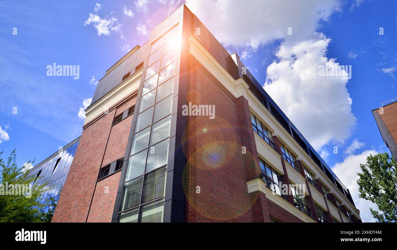 Modern residential building with new apartments in a green residential ... - Green Apartment Home Builders