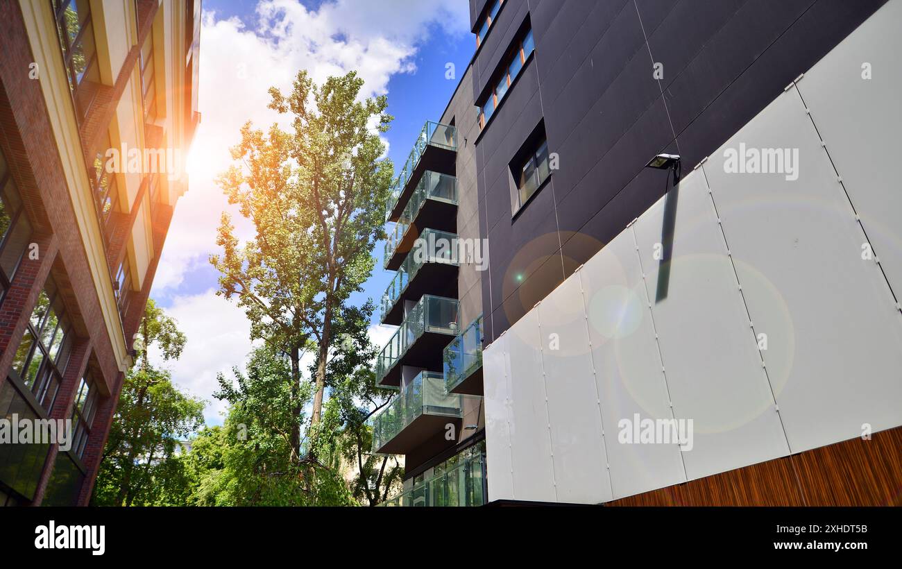Modern residential building with new apartments in a green residential ...