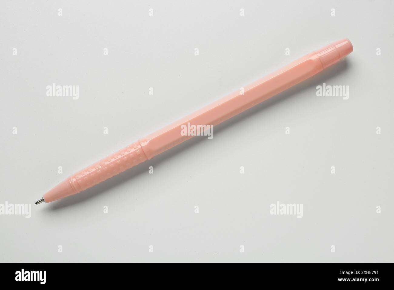 Pink ballpoint pen on white background Stock Photo