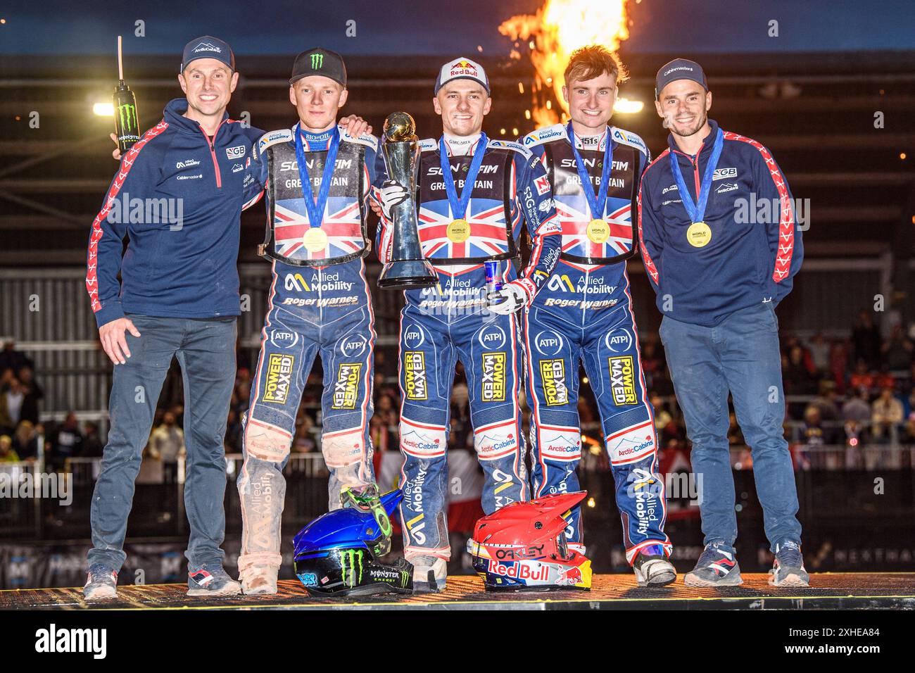 GREAT BRITAIN World Champions: (L to R) British Joint Team manager, Simon Stead, Dan Bewley, Robert Lambert, Tom Brennan, British Joint Team manager, Oliver Allen celebrate winning the trophy during the Monster Energy FIM Speedway of Nation Final at the National Speedway Stadium, Manchester on Saturday 13th July 2024. (Photo: Ian Charles | MI News) Credit: MI News & Sport /Alamy Live News Stock Photo