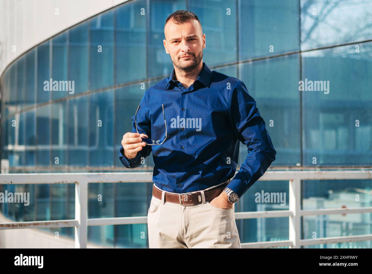 Man in glasses blue shirt hi-res stock photography and images - Alamy