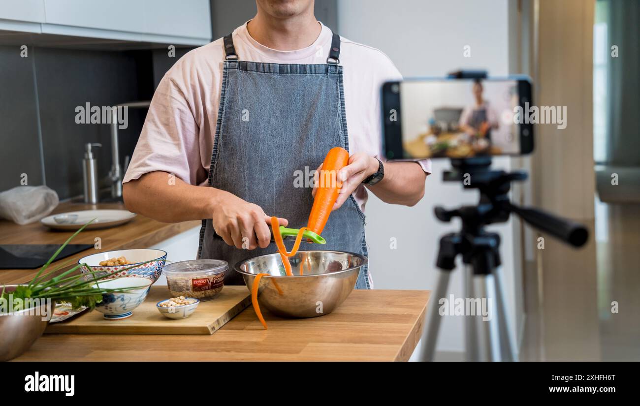 The chef is broadcasting live from workshop how to prepare a vegetarian massaman curry Stock Photo