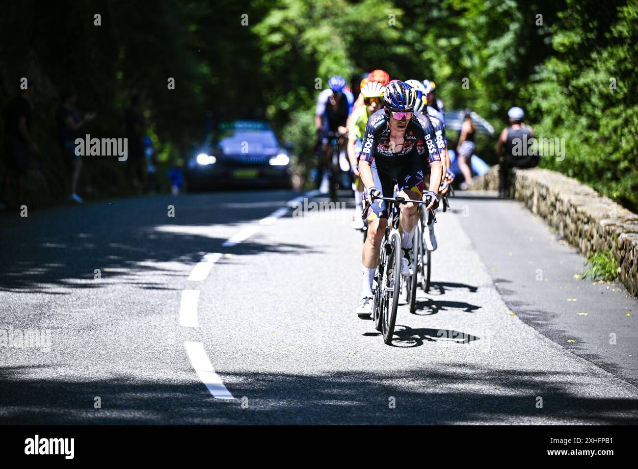 Plateau De Beille, France. 14th July, 2024. Luxembourgian Bob Jungels of Red Bull-Bora-Hansgrohe pictured in action during stage 15 of the 2024 Tour de France cycling race, from Loudenvielle to Plateau de Beille, France (107, 7 km), on Sunday 14 July 2024. The 111th edition of the Tour de France starts on Saturday 29 June and will finish in Nice, France on 21 July. BELGA PHOTO JASPER JACOBS Credit: Belga News Agency/Alamy Live News Stock Photo