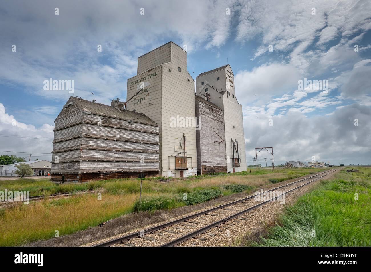 Old wooden grain elevators beside railway tracks at the village of ...