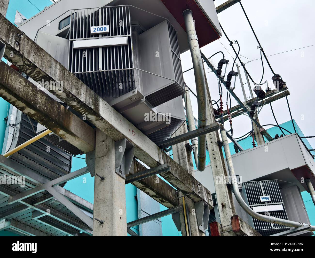 The blue building is covered in various electrical equipment Stock ...