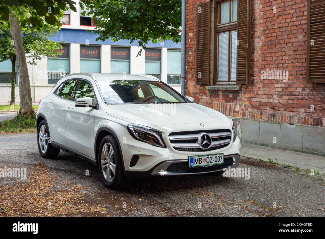MARIBOR, SLOVENIA - JULY 16, 2015: White Mercedes-Benz GLA X156 crossover parked on street Stock Photo