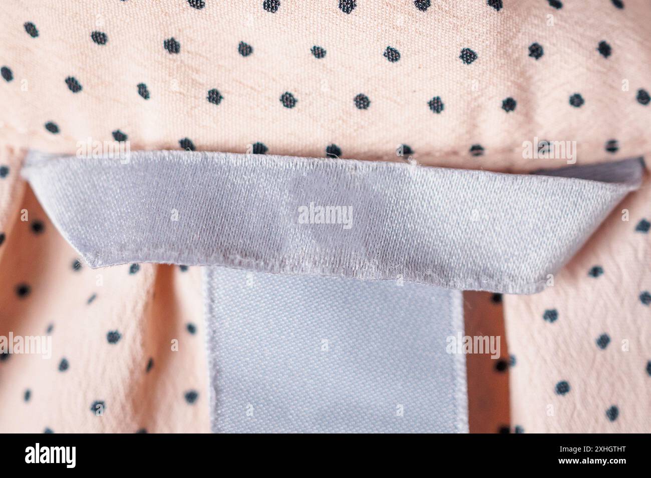 Blank Clothing label closeup on fabric texture Stock Photo - Alamy