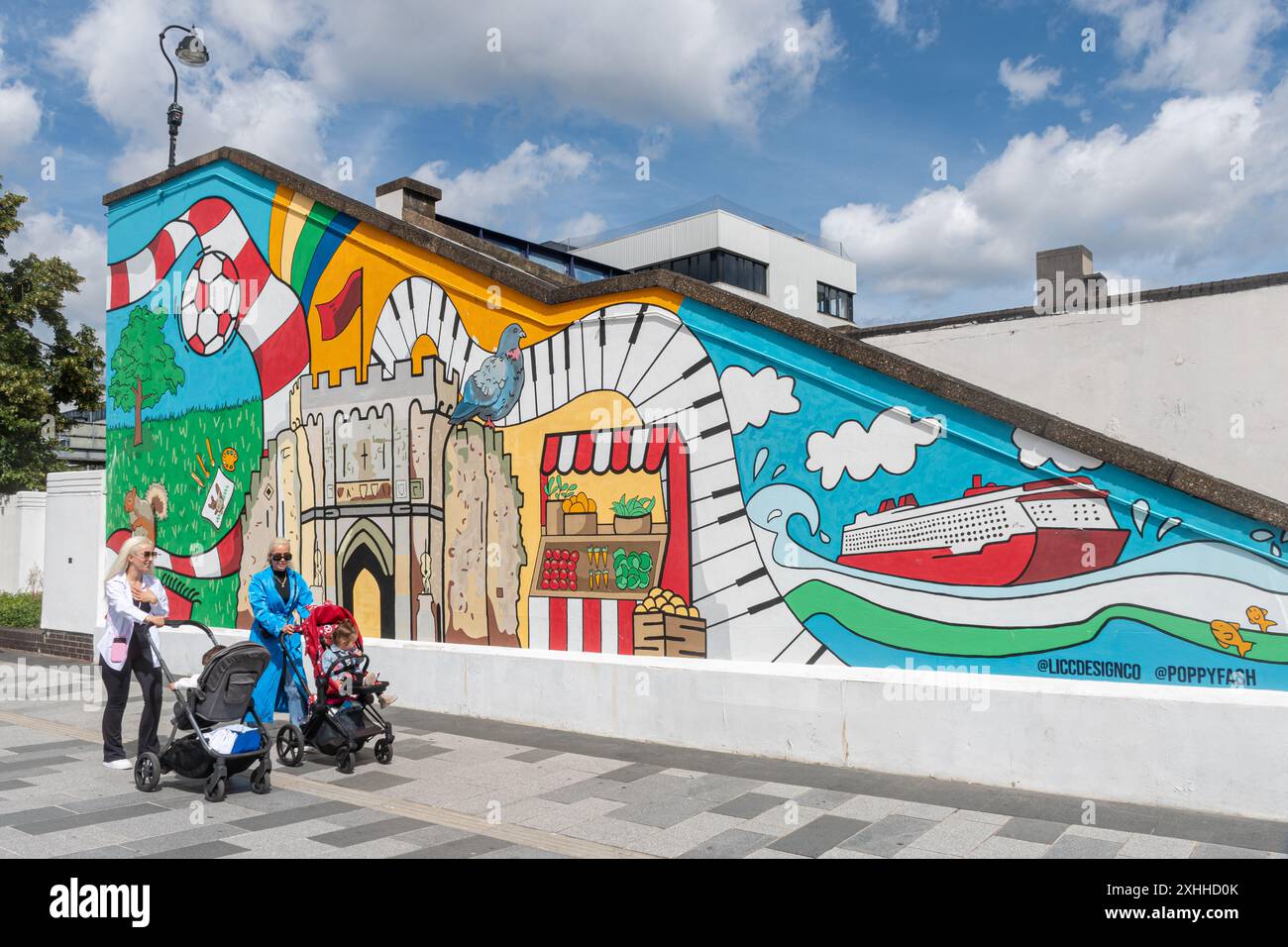 Colourful wall painting outside Southampton Central Station on a footbridge over the railway, Hampshire, England, UK, with city landmarks Stock Photo