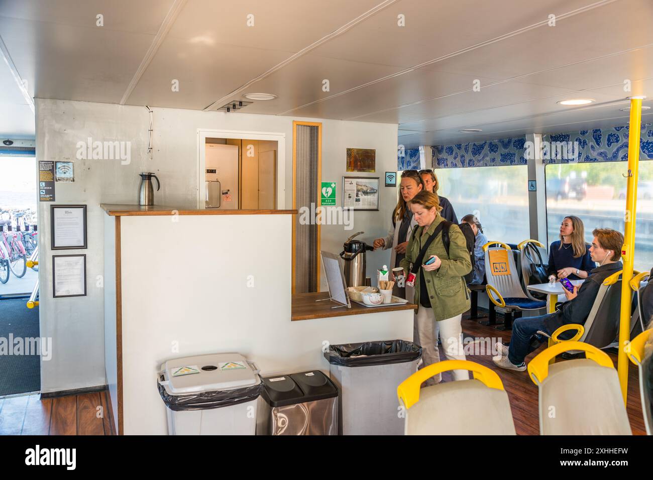 Commuter ferries are used by daily commuters on their way to work in Stockholm, which is located on 14 islands. Coffee is offered free of charge on the commuter ferry (Pendelbåt) from Stockholm at breakfast time. Brostugevägen, Lidingö kommun, Stockholm, Sweden Stock Photo