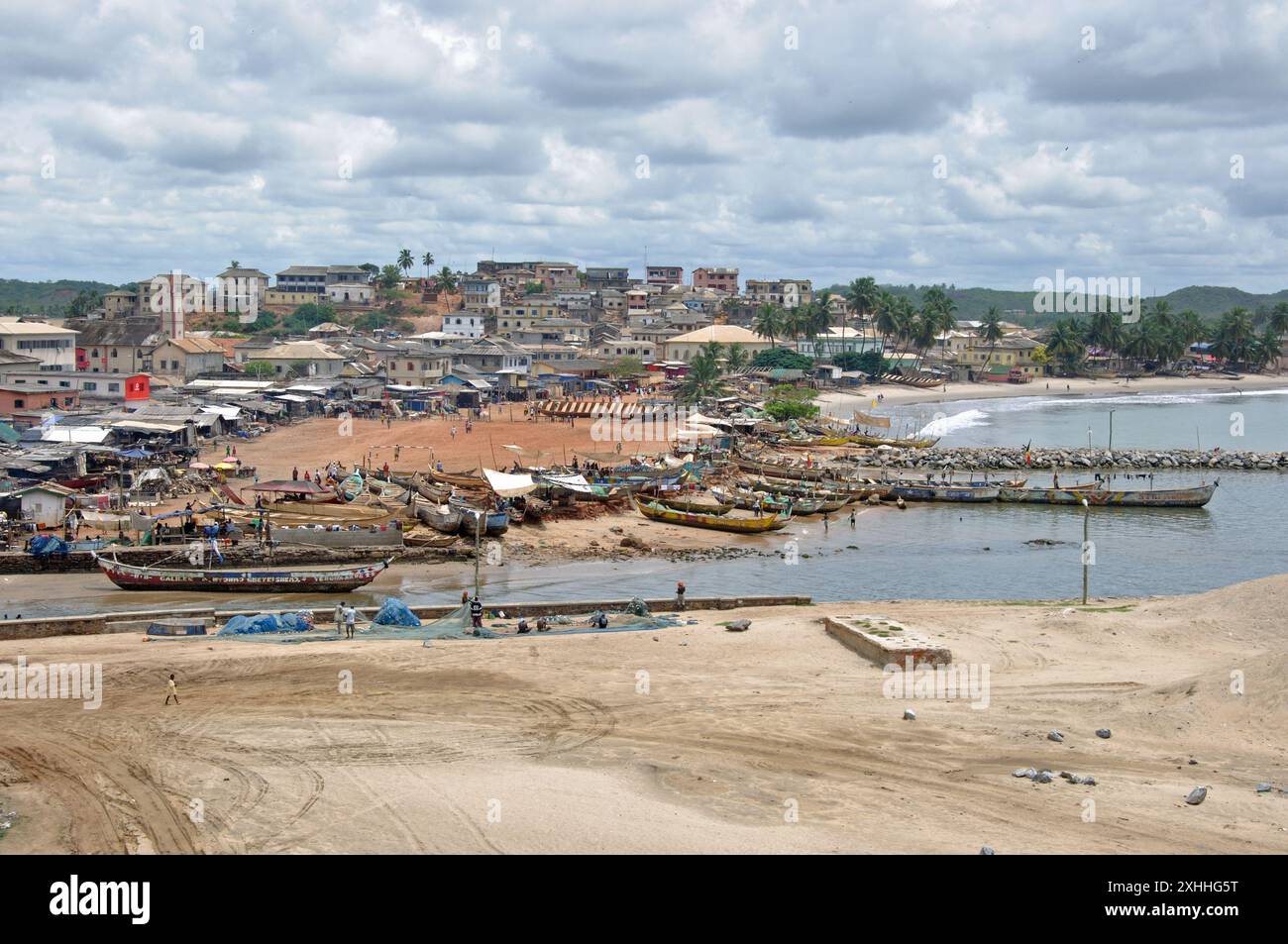 Ghanaian life below Cape Coast Castle. Cape Coast, Ghana - town with ...