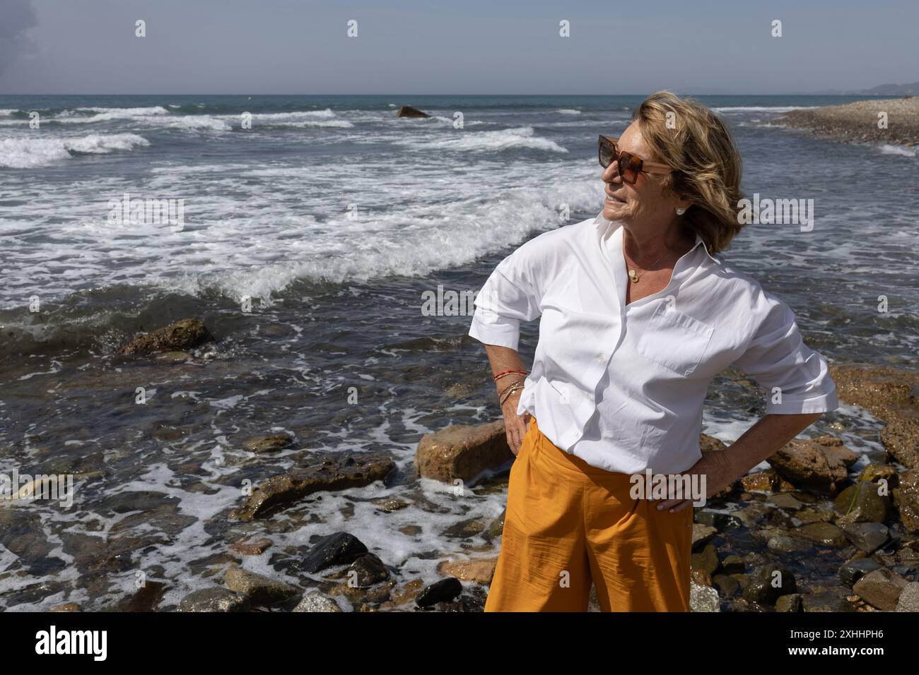 Mature woman in orange shirt hi-res stock photography and images - Alamy