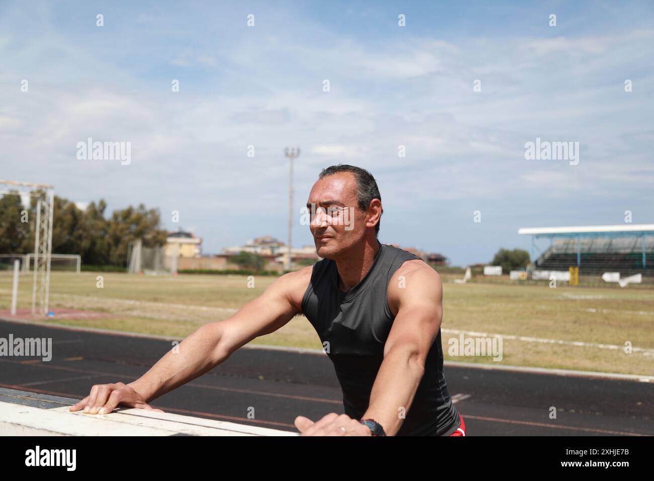 Man track stretching arms hi-res stock photography and images - Alamy