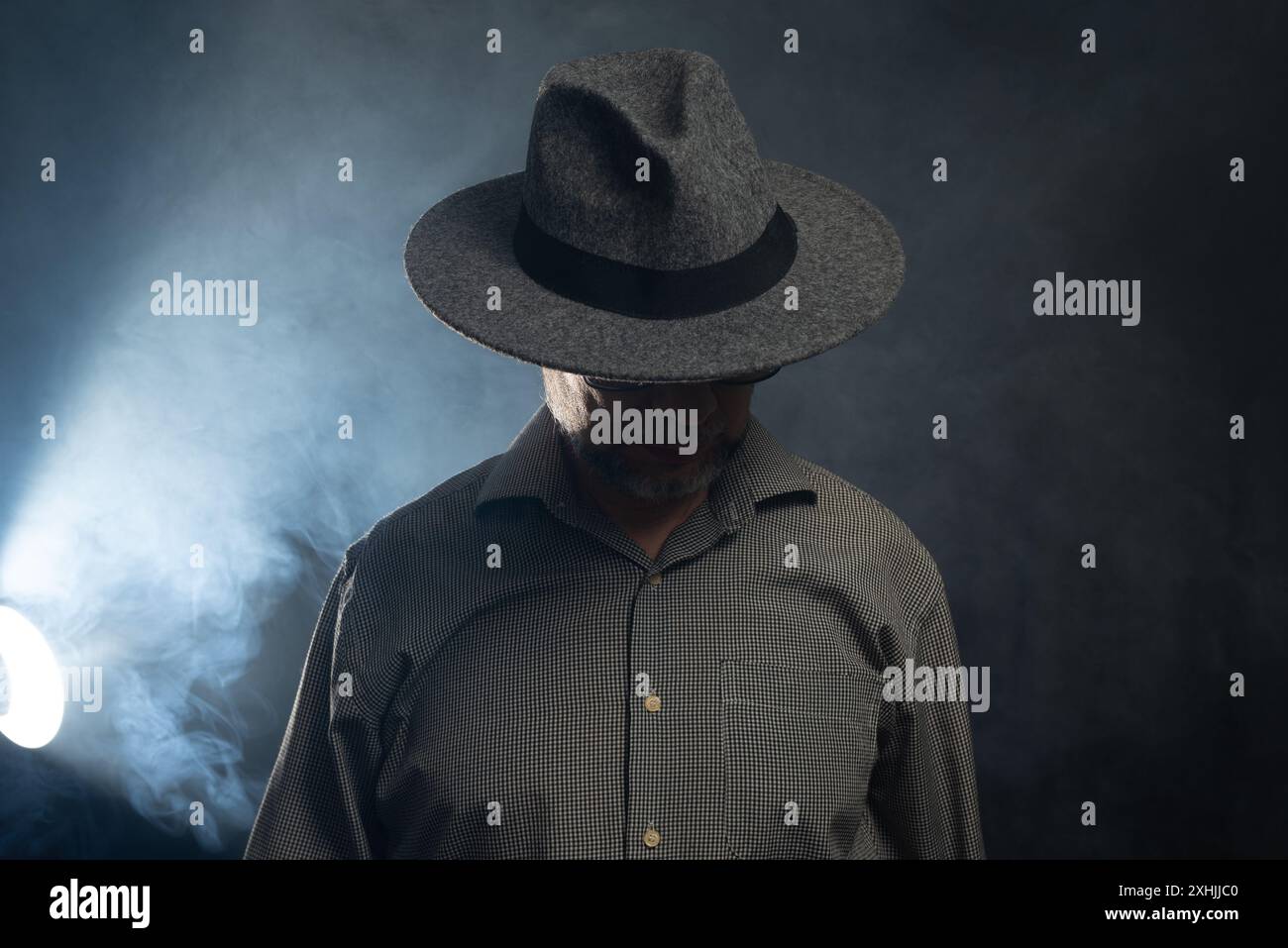 Portrait of man with beard and sunglasses and hat posing for ...