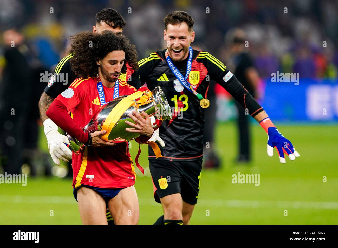 Berlin, Germany. 14th July, 2024. BERLIN, GERMANY - JULY 14: Marc Cucurella of Spain holding the trophy, Alex Remiro of Spain, Dani Olmo of Spain celebrating victory during the UEFA EURO 2024 Final match between Spain and England at Olympiastadion on July 14, 2024 in Berlin, Germany. (Photo by Andre Weening/Orange Pictures) Credit: Orange Pics BV/Alamy Live News Stock Photo