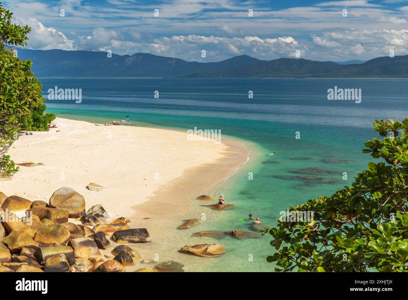 Picturesque tropical golden Nudey Beach with turquoise water on Fitzroy Island. It is a