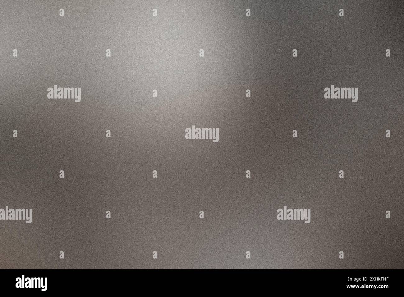 Smooth grainy metallic gradient background illuminated with a soft light Stock Photo