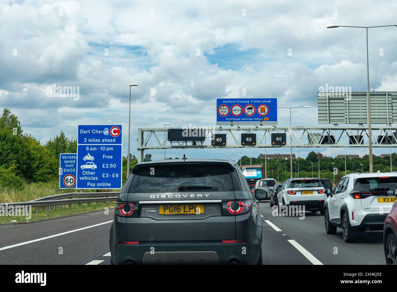 Queues of traffic on the M25 motorway heading towards the Dartford Tunnel in Kent, UK. Congestion. Dart charge prices. Toll costs. Speed limit Stock Photo