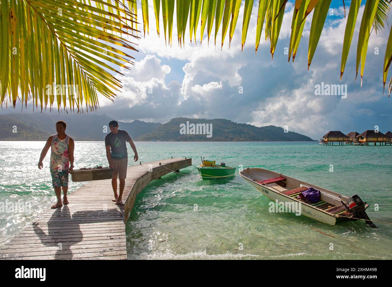 French Polynesia, Taha'a island, fishermen on the pontoon of the Taha'a ...