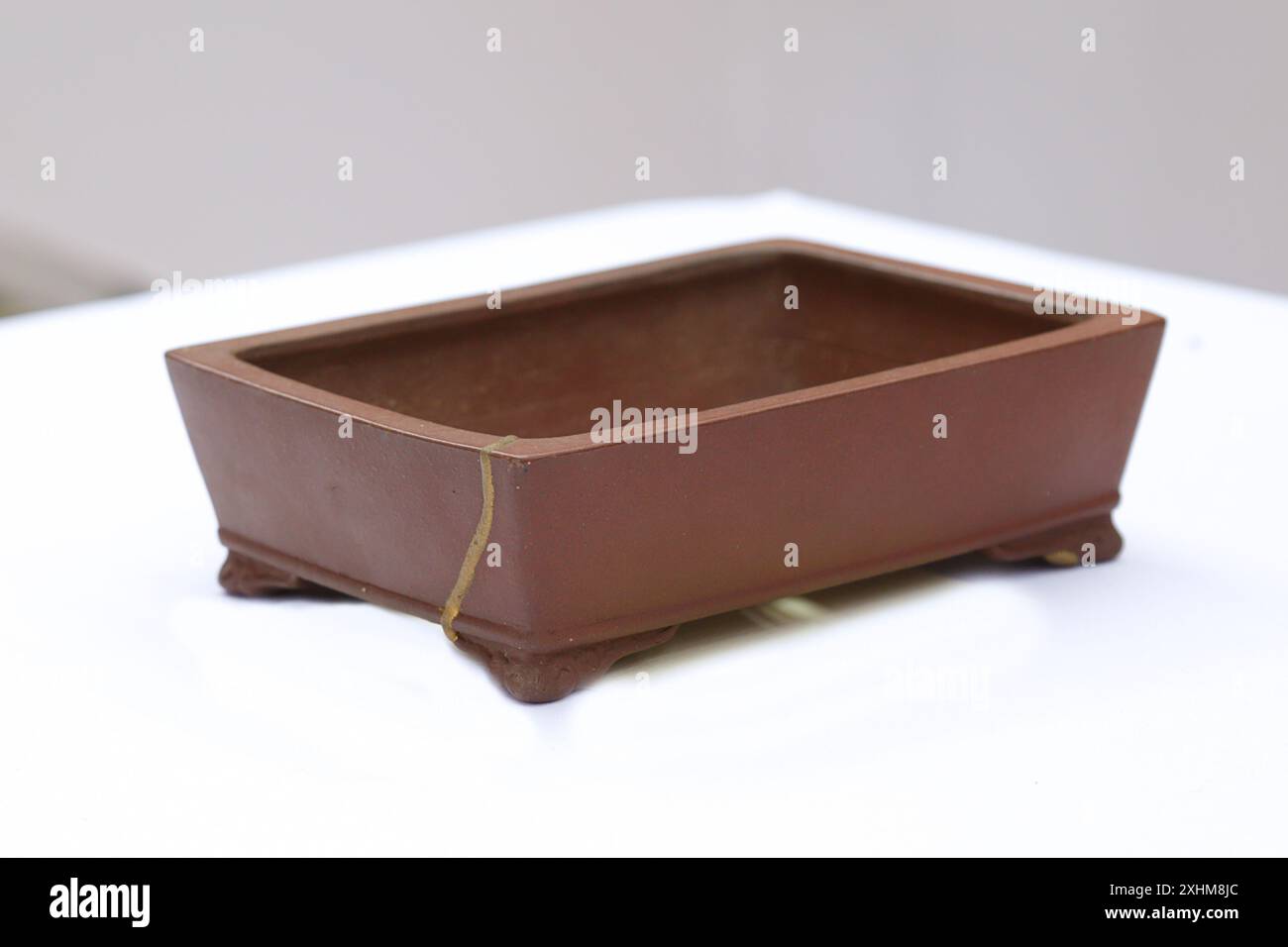 Brown empty bonsai pot on white background Stock Photo