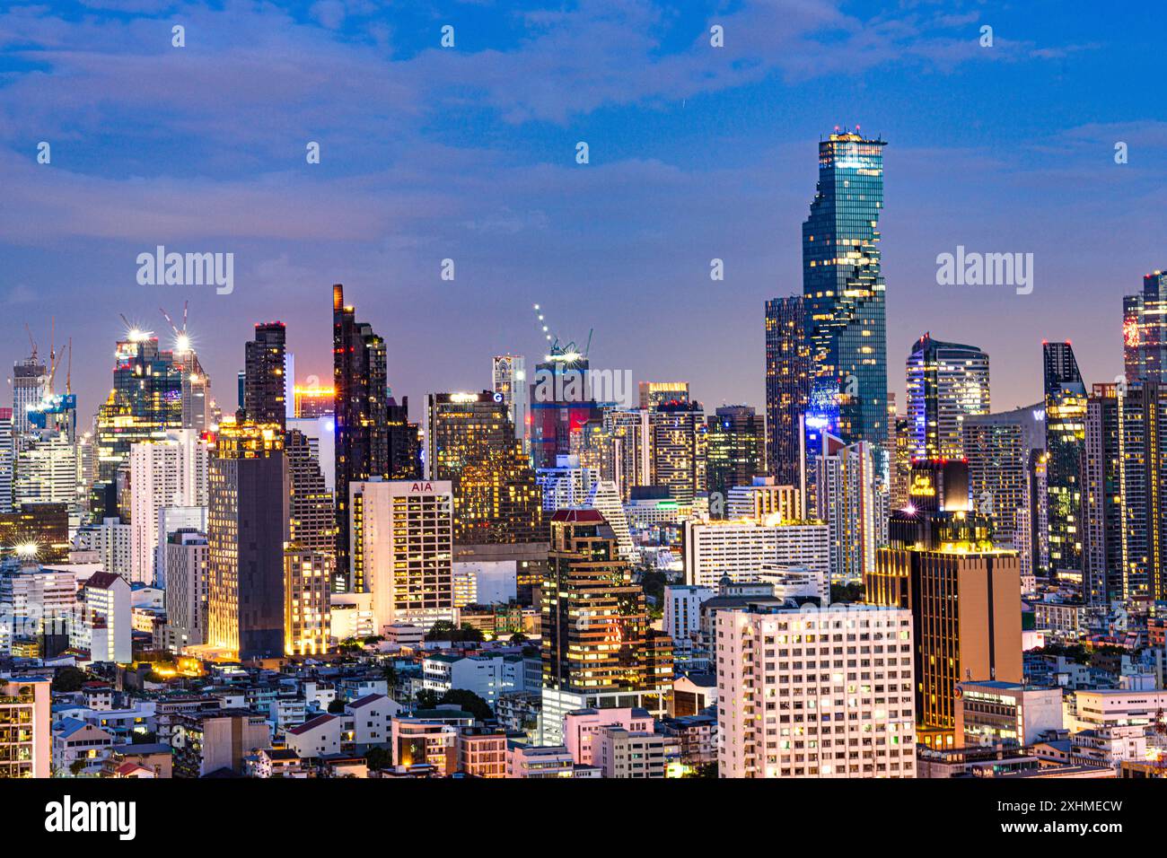 Illuminated skyscrapers of Bangkok skyline at dusk Stock Photo - Alamy