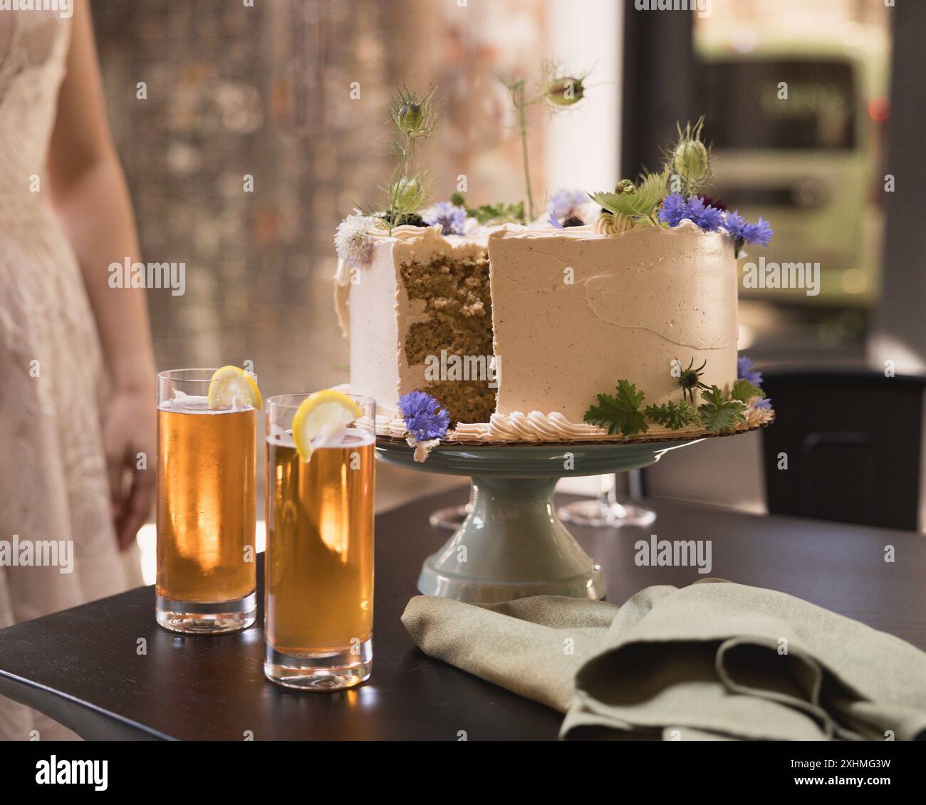 Cut Wedding Cake with Drinks on Table Stock Photo