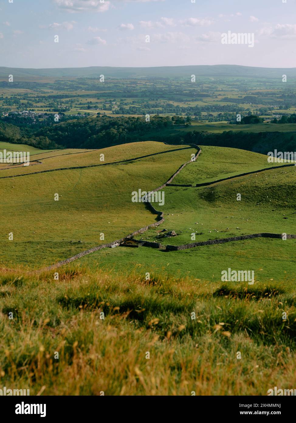 The view from Twistleton Scar Whernside looking south to Ingleborough village in the Yorkshire Dales National Park, North Yorkshire England Stock Photo