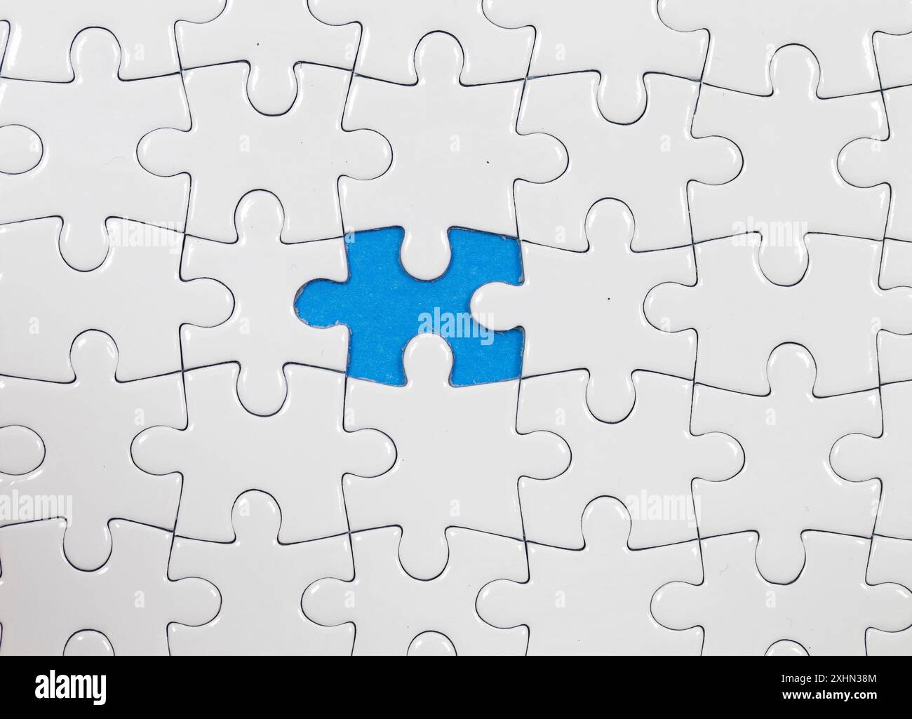 Jigsaw puzzle with one piece missing Stock Photo