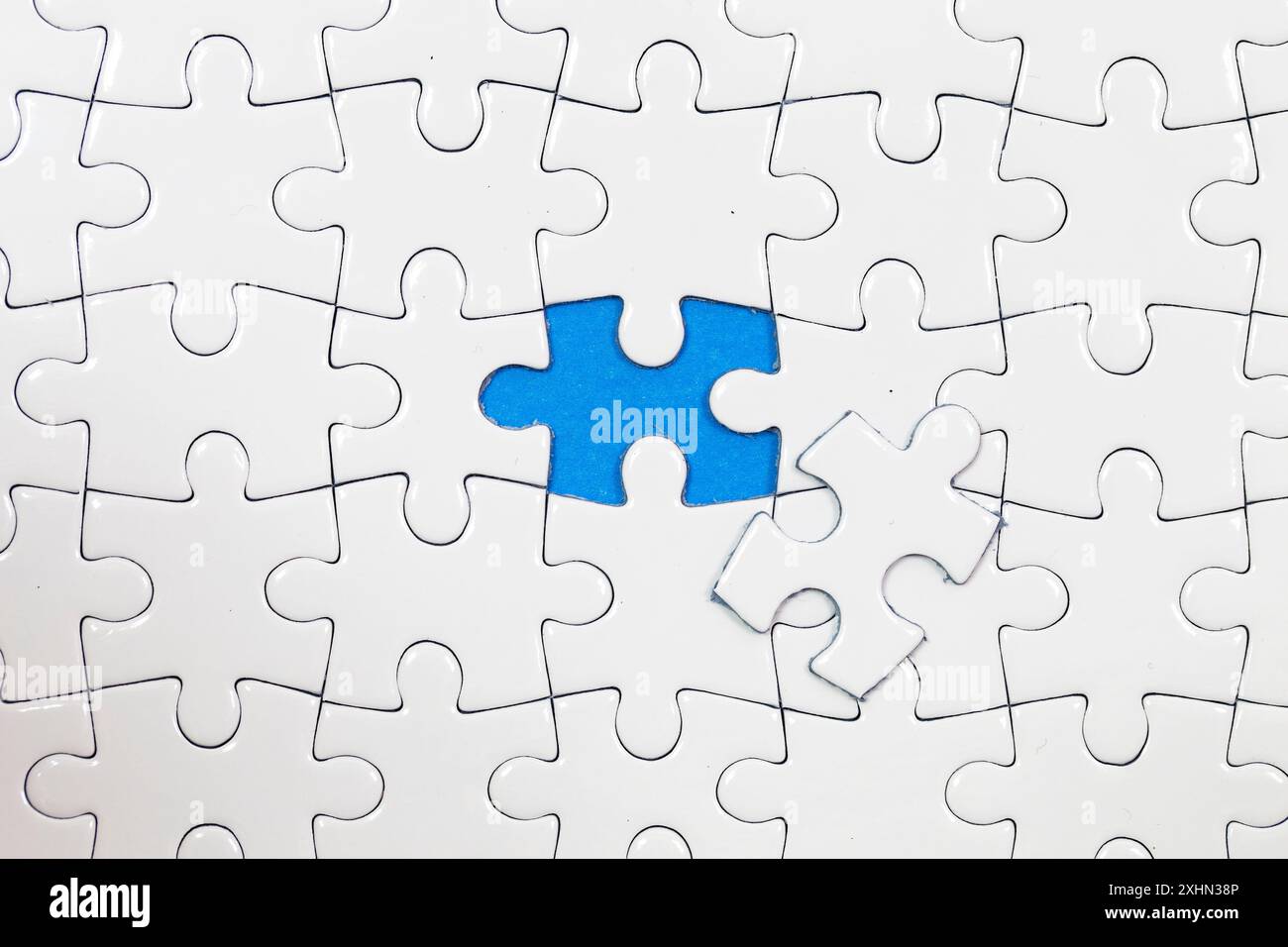 Jigsaw puzzle with one piece missing Stock Photo